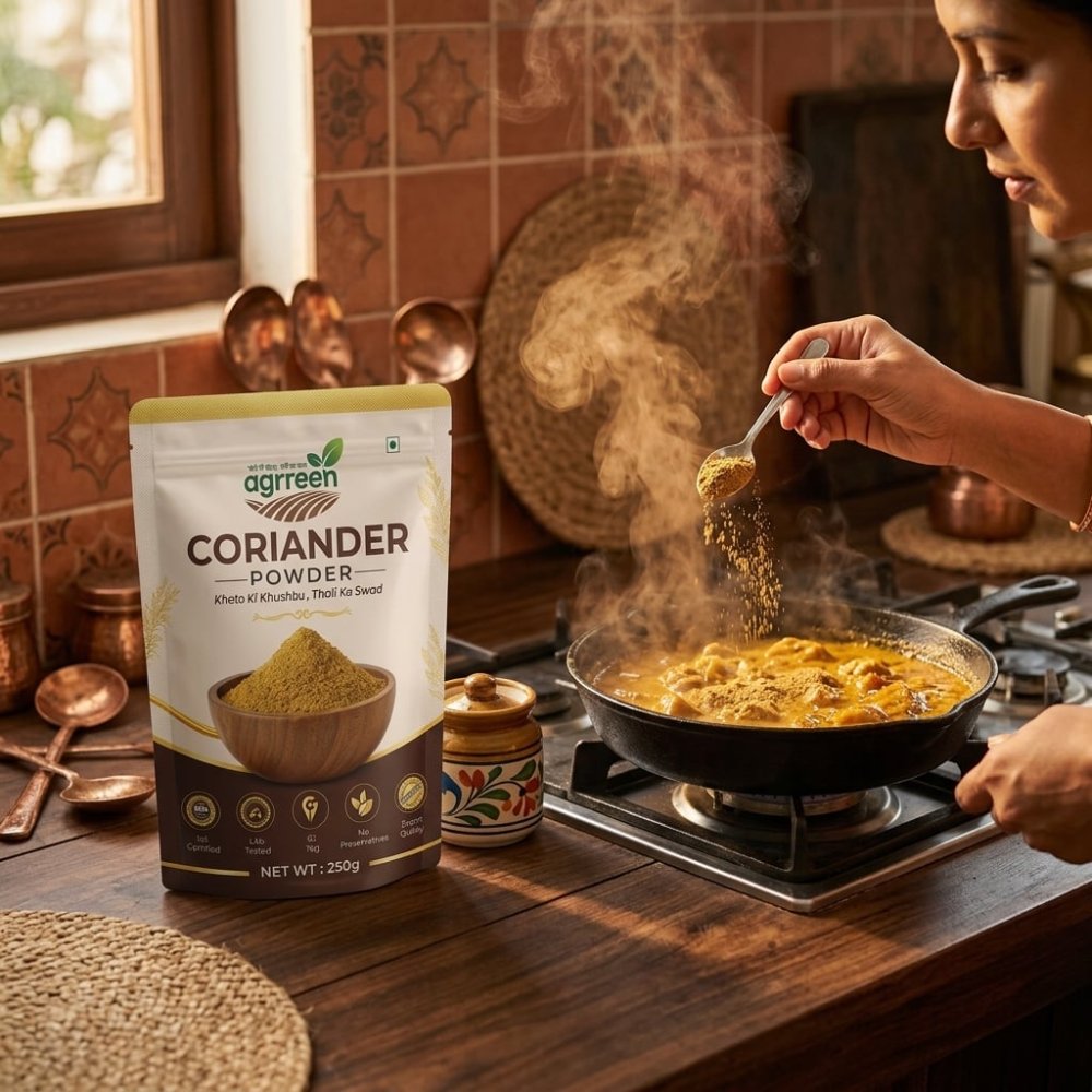 AGRREEN Coriander Powder pack on a kitchen counter beside a woman adding coriander powder to a curry on the stove
